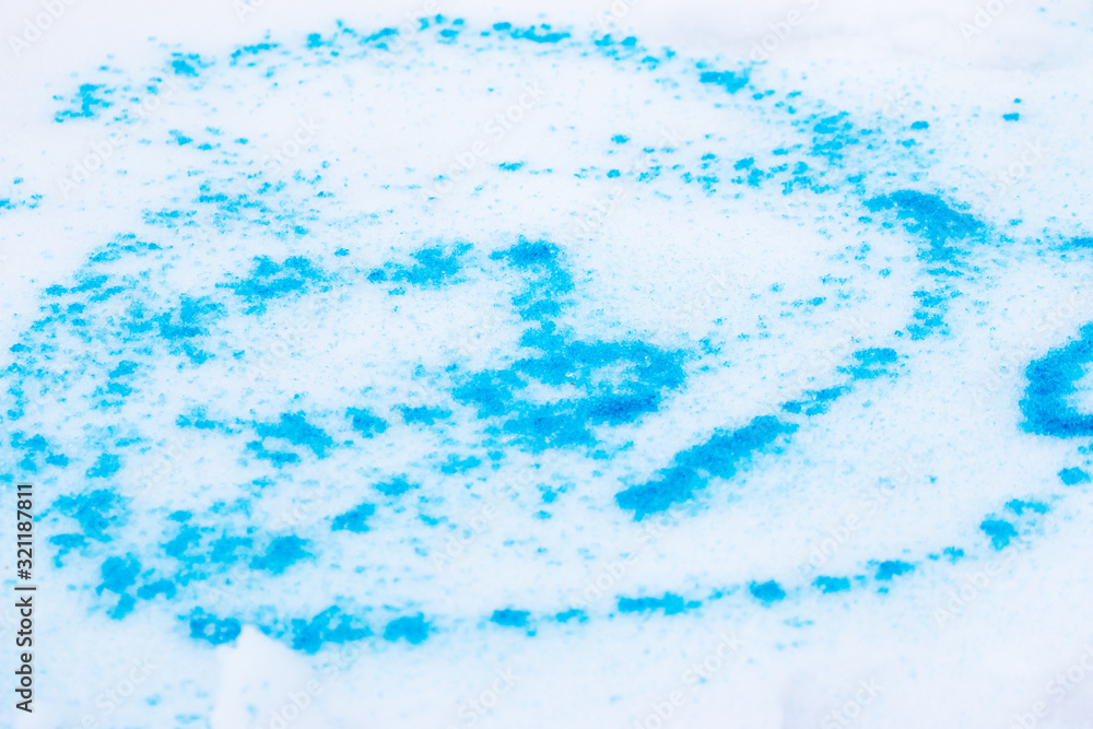 spots of blue paint on white snowspots of blue paint on white snow