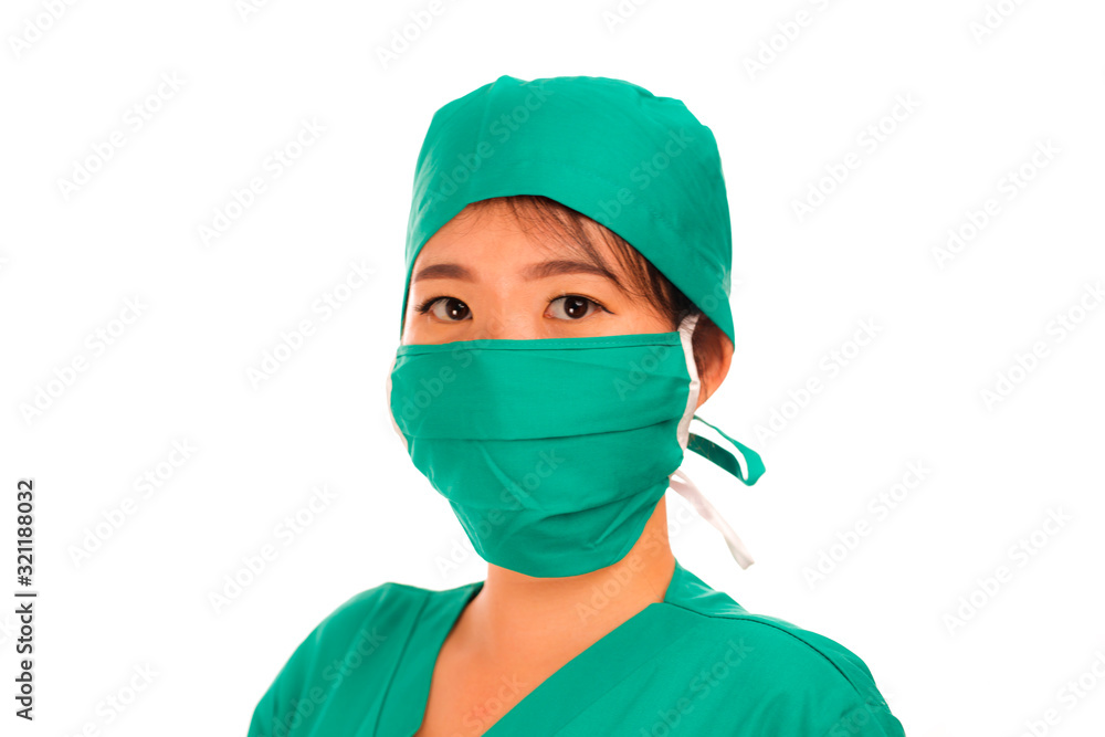 beautiful and serious Asian Chinese medicine doctor woman or hospital nurse in medical hat surgeon face mask and green scrub in virus treatment and health care concept beautiful and serious Asian Chinese medicine doctor woman or hospital nurse in medical hat surgeon face mask and green scrub in virus treatment and health care concept