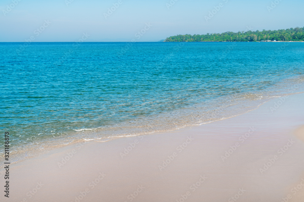 Tropical sea beach with sand and wave of the sea