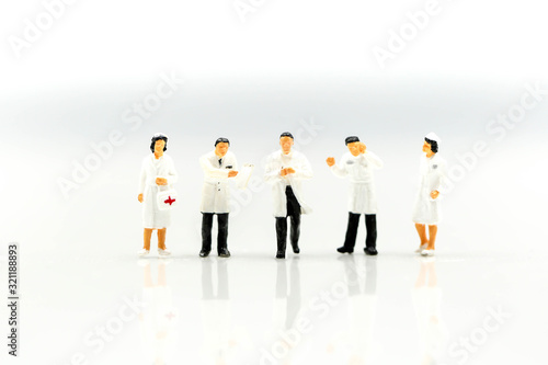 Miniature people : Doctor and Nurse emergency medical team with pills and Ambulance ,Health care, medical service, and insurance concept.