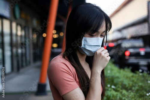 Beautiful asia Woman suffer from sick and wearing face mask protect filter against air pollution (PM2.5),Air pollution caused health problem,anti smog and viruses