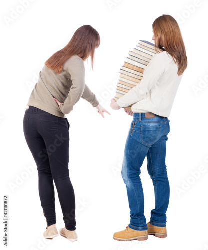 Back view of two pointing young girl in sweater.