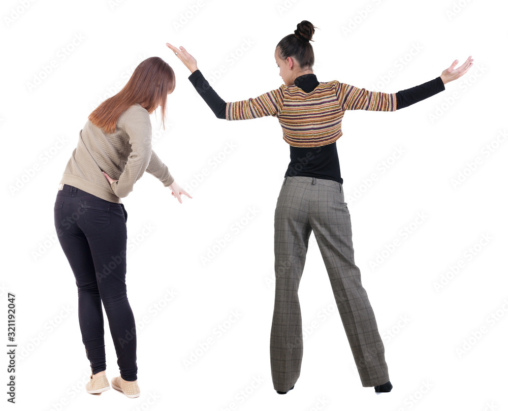 Back view of two pointing young girl in sweater. Back view of two pointing young girl in sweater.