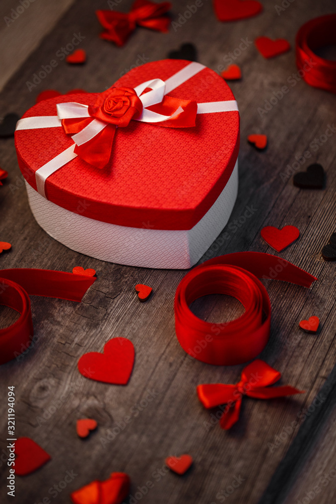 Love and holiday greeting concept background. Symbol of love. Red ribbon and heart decor. Love and holiday greeting concept background. Symbol of love. Red ribbon and heart decor.