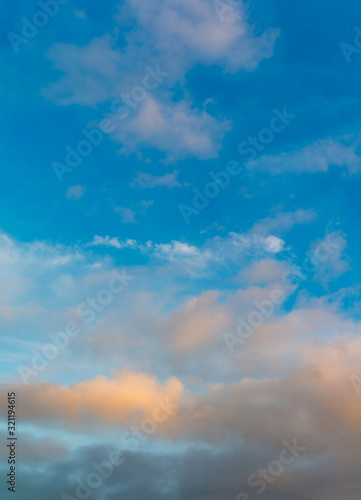 Fototapeta Naklejka Na Ścianę i Meble -  Fantastic clouds at sunrise, vertical panorama