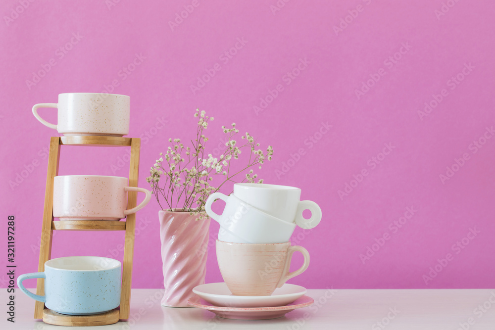 modern cups on white table on background pink wall modern cups on white table on background pink wall