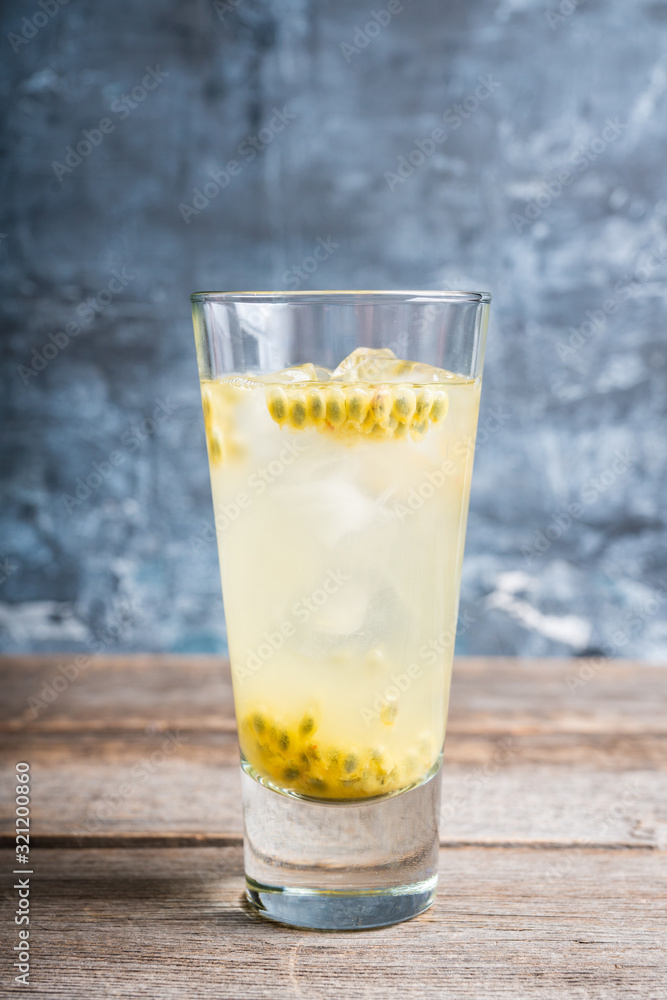 Passion fruit cocktail in highball glass. Selective focus. Shallow depth of field. Passion fruit cocktail in highball glass. Selective focus. Shallow depth of field.