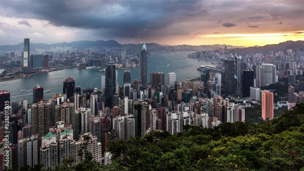 Time lapse Hong Kong skyline at dramatic sunrise from Victoria peak