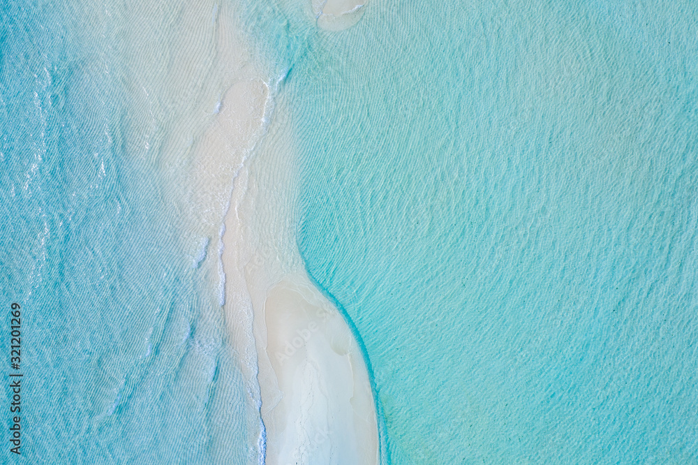 Beautiful aerial photo of exotic sandbank, idyllic tropical beach landscape, blue sea ripples and white sand. Romantic and relaxing summer mood background or wallpaper 