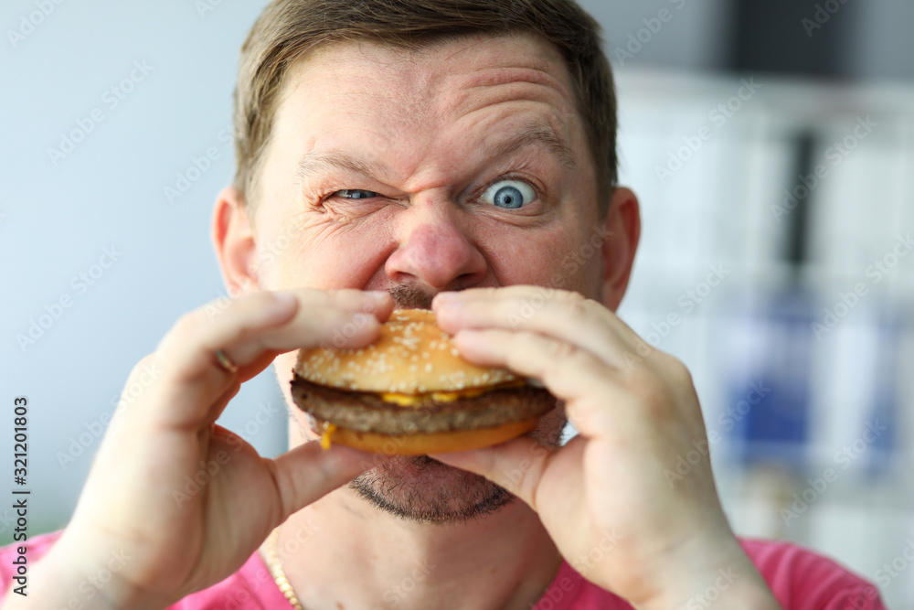 Championship on eating burgers, high-speed eating. Hunger, daily human diet. An experiment with quality products, amazing taste and unusual combinations. High calorie meal. Whole grain burger. Championship on eating burgers, high-speed eating. Hunger, daily human diet. An experiment with quality products, amazing taste and unusual combinations. High calorie meal. Whole grain burger.