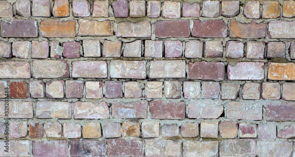 Old brickwork or wall of old brick background. Texture and pattern of a brick stone wall
