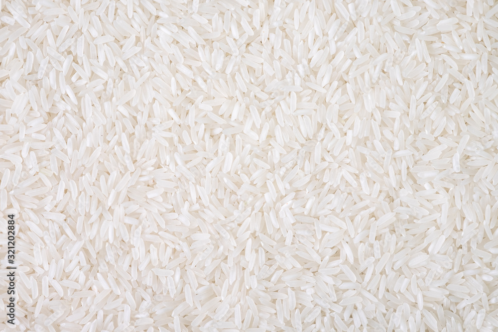 Top view of white rice seed texture background. Organic, natural long rice grain, food for healthy. Agriculture of culture asian. Flay lay - obrazy, fototapety, plakaty 