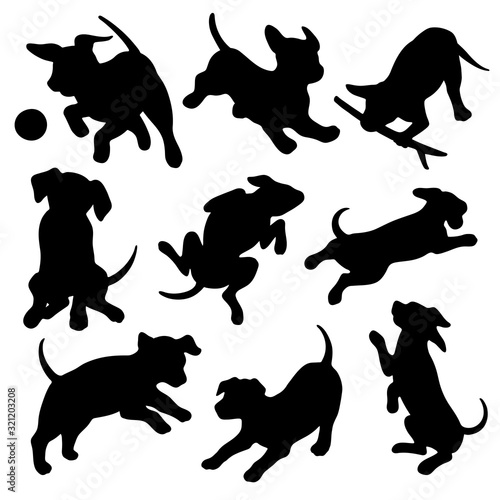 Black silhouettes of puppies or dogs in different poses