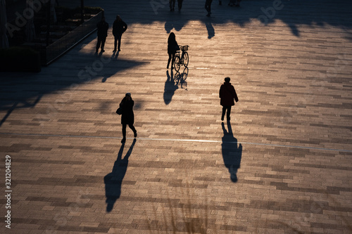 CityLife Business, Shopping and residential area in Milan, Italy. People walking in backlight.