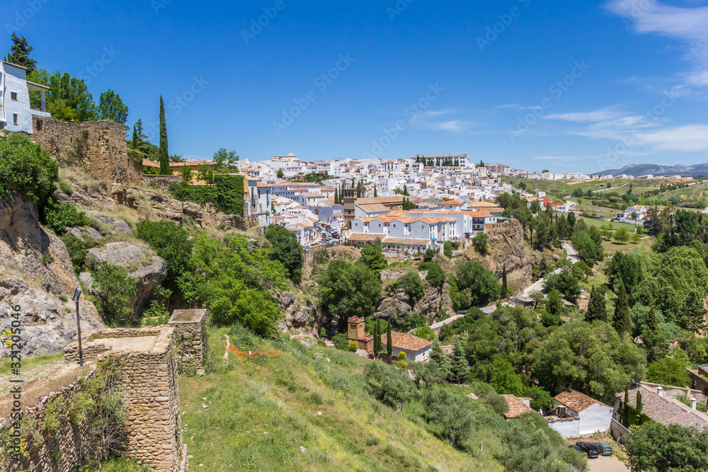 Levante city wall and white houses of Ronda, Spain