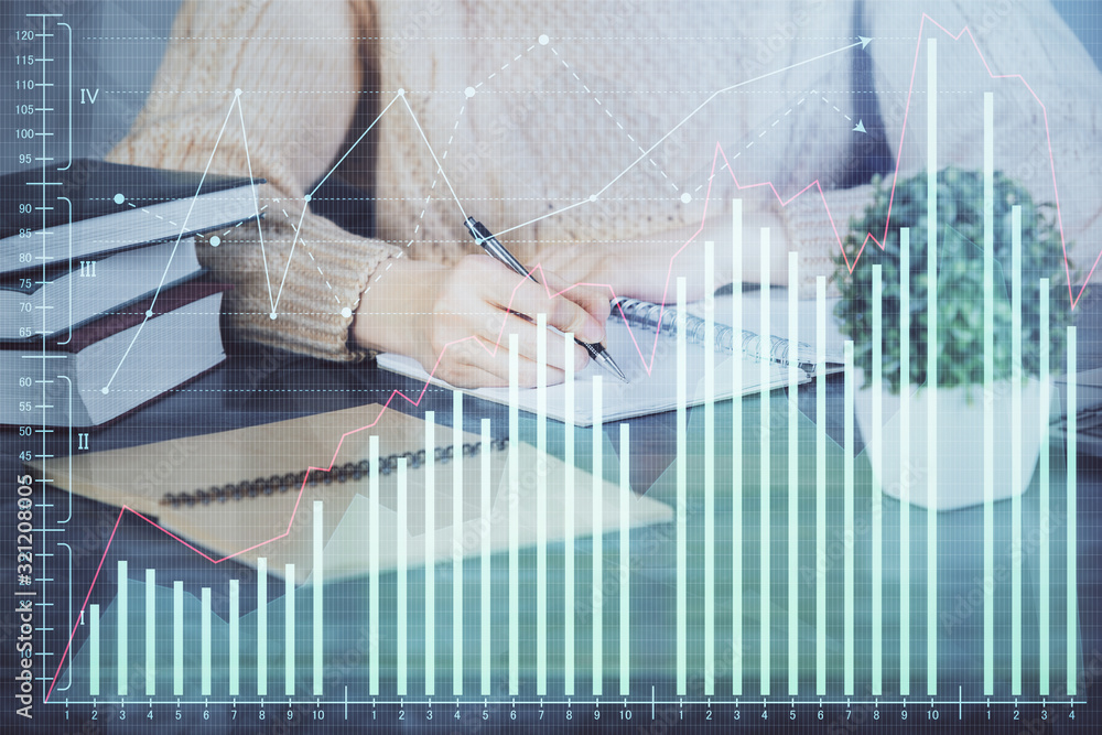 Forex graph on hand taking notes background. Concept of research. Double exposure Forex graph on hand taking notes background. Concept of research. Double exposure