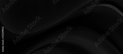 Black gray satin dark fabric texture luxurious shiny that is abstract silk cloth background with patterns soft waves blur beautiful.