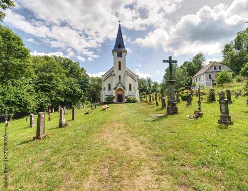 Church and graveyard in Zadni Zvonkova,  a border village photo