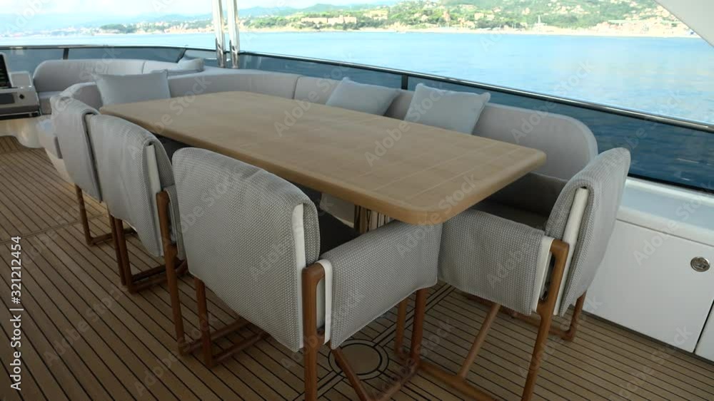 Dining area on the upper deck of a luxury yacht. Dining area on the upper deck of a luxury yacht.