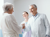 Doctor and nurse meeting a senior patient at the hospital