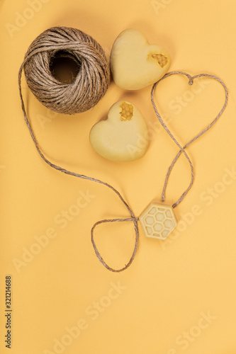  Harness linen and handmade soap on a yellow background