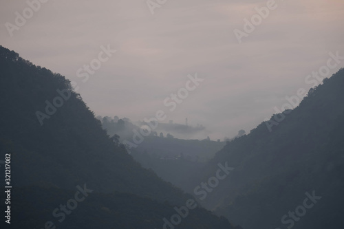 view of mountains in fog