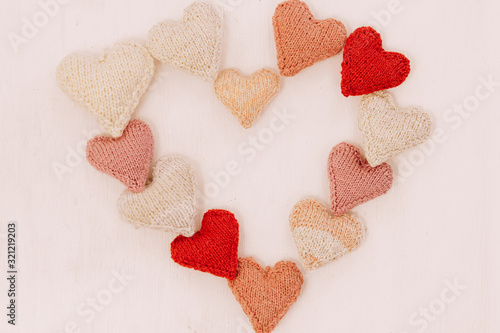 Wallpaper Mural Hand made knitted heart on white wooden background. Valentine's day card with woolen heart and free space. Romantic sign.Hand made knitted heart on white wooden background. Valentine's day card with w Torontodigital.ca