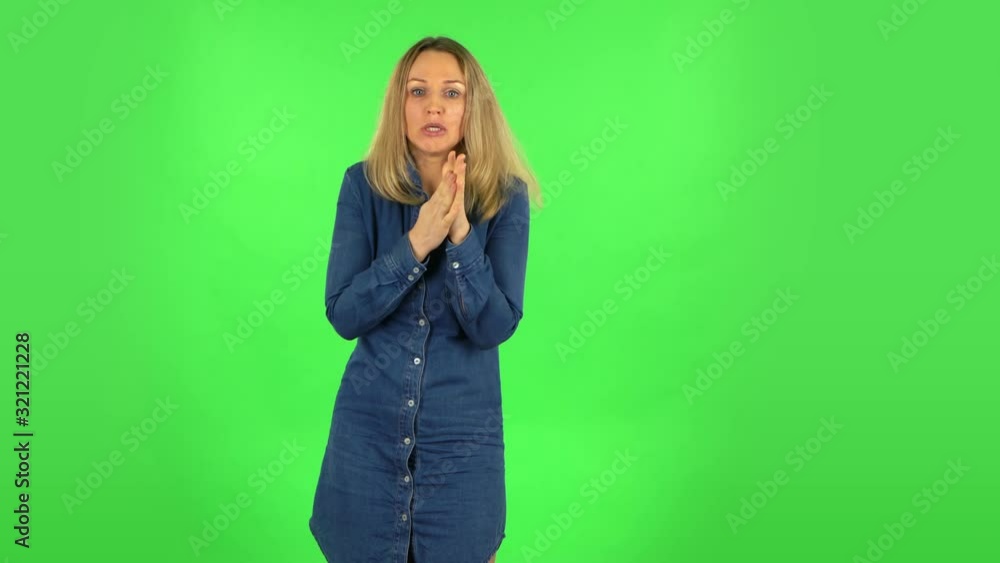 Fair woman froze and trying to keep warm. Green screen Fair woman froze and trying to keep warm. Green screen