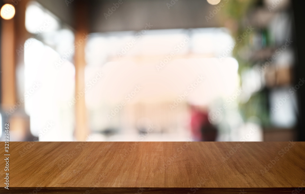 Empty dark wooden table in front of abstract blurred bokeh background of restaurant . can be used for display or montage your products.Mock up for space. Empty dark wooden table in front of abstract blurred bokeh background of restaurant . can be used for display or montage your products.Mock up for space.