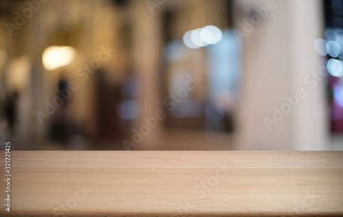 Wallpaper Mural Empty dark wooden table in front of abstract blurred bokeh background of restaurant . can be used for display or montage your products.Mock up for space. Torontodigital.ca