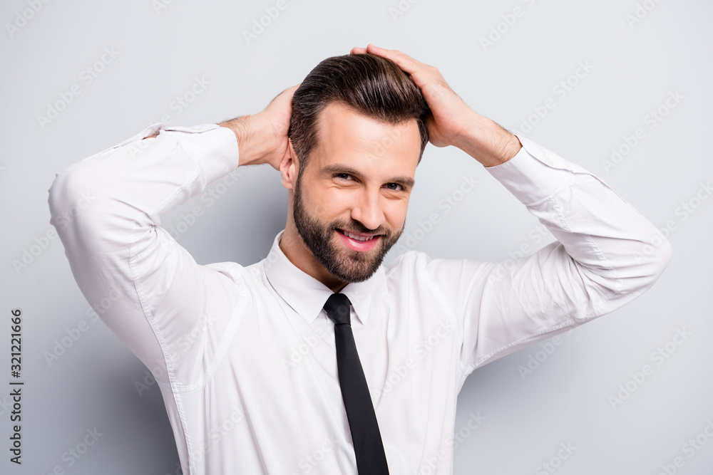Closeup photo of young macho business man touch perfect groomed hairstyle after salon styling beaming smiling wear white office shirt tie isolated grey color background Closeup photo of young macho business man touch perfect groomed hairstyle after salon styling beaming smiling wear white office shirt tie isolated grey color background