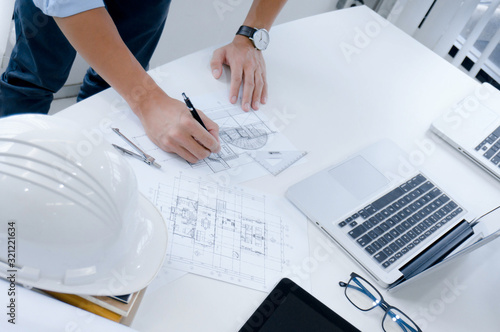 Colleagues interior designer Corporate Achievement Planning Design on blueprint Teamwork Concept with compasse.