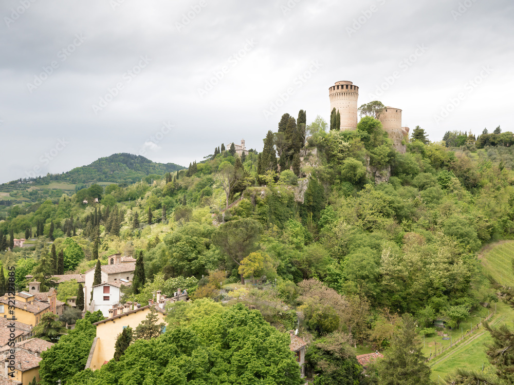 Obraz premium Brisighella, Ravenna, Emilia Romagna, Italy: The fortress. The fortress, The Clock Tower and Monticino church charaterize the landscape for wich Brisighella is famous.