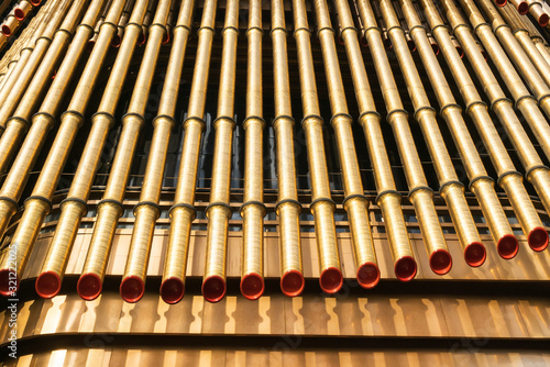 A close-up of the golden tubular structure