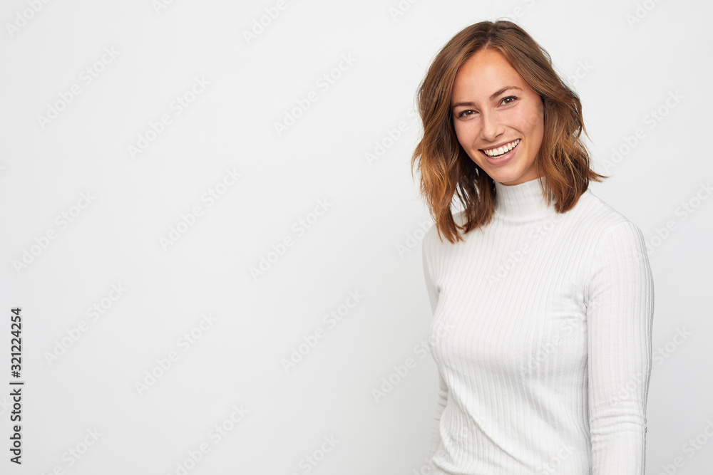 portrait of young happy woman looks in camera portrait of young happy woman looks in camera