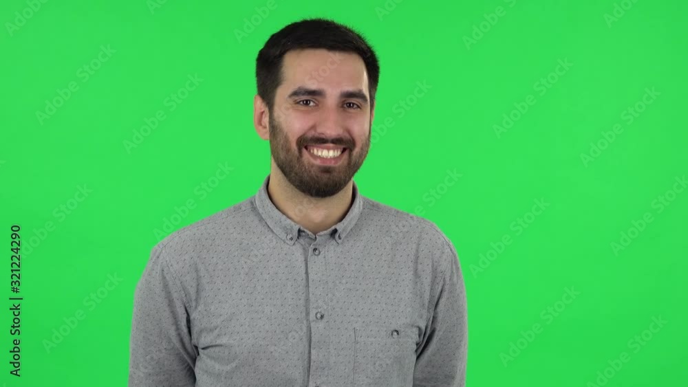 Portrait of brunette guy is laughing. Green screen Portrait of brunette guy is laughing. Green screen