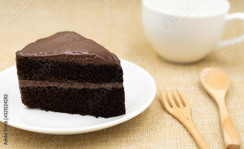Chocolate cake with a white coffee cup.