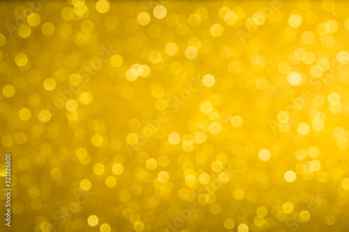  gold colorful defocused background with festive light bokeh. gold sparkles background