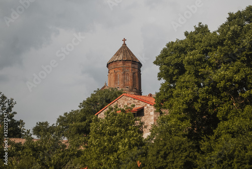 The tower of the temple among the trees, an ancient monastery,