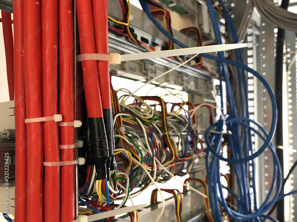 Multi colored network cables connected to data center server