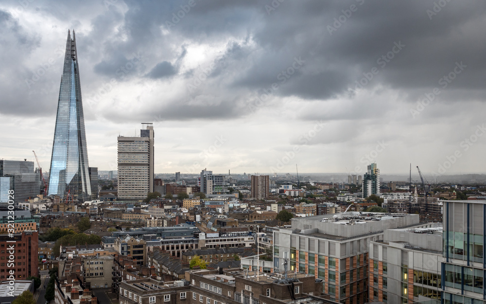South London skyline. An overcast view over Southwark dominated by the modern architecture of The Shard building.