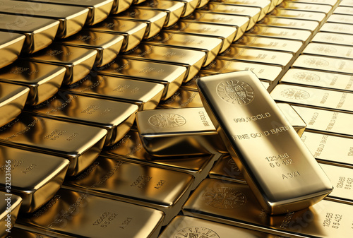 Ingots gold bars stacked aligned with two placed randomly.