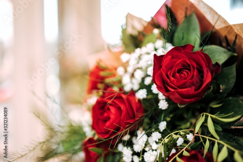 Close-up image of a flower bouquet with red roses  copy space.