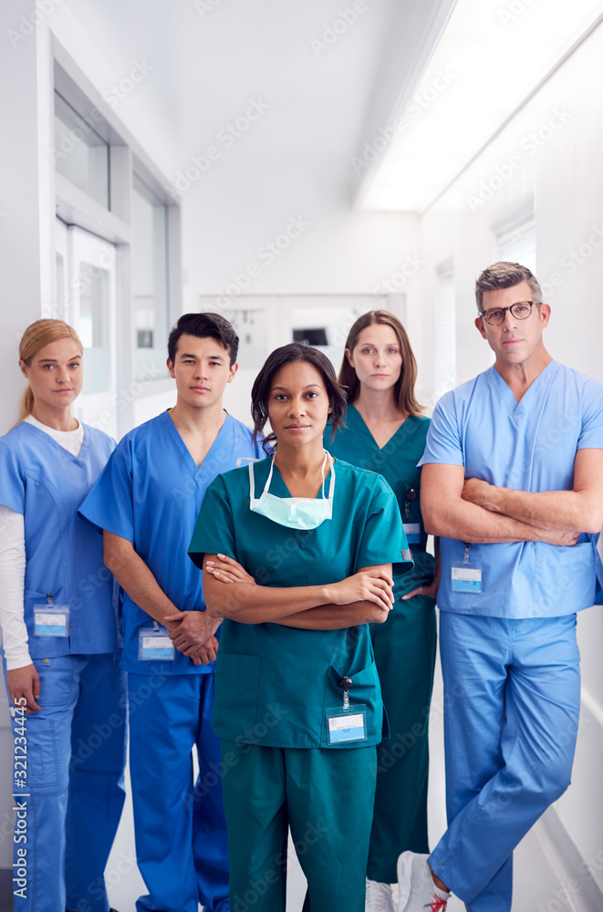 Portrait Of Multi-Cultural Medical Team Standing In Hospital Corridor Portrait Of Multi-Cultural Medical Team Standing In Hospital Corridor