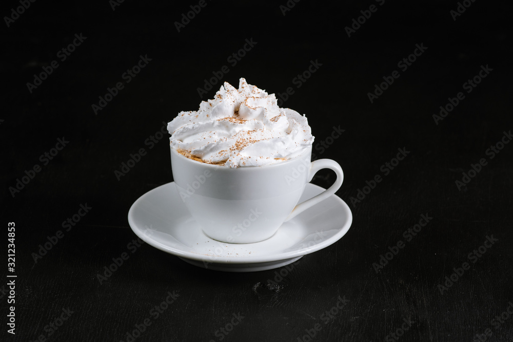 Cup with coffee and creams on black background Cup with coffee and creams on black background