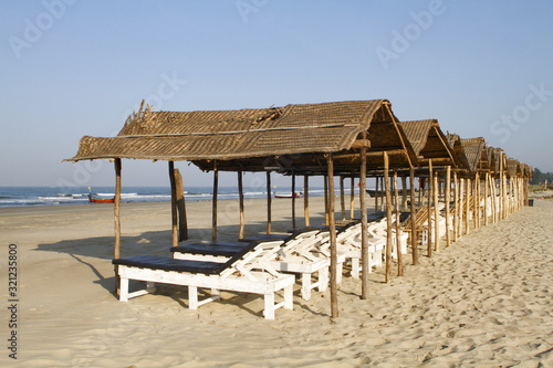 Shaded beach beds at Mandrem beach Pernem Goa  India