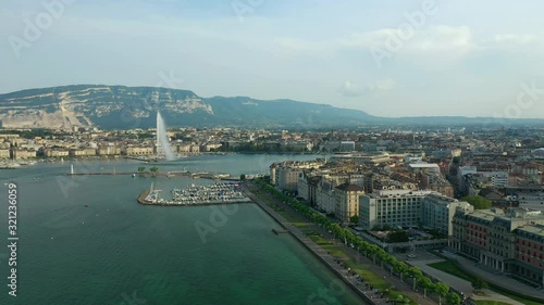 sunny evening geneva city famous lake fountain traffic bay aerial panorama 4k switzerland
