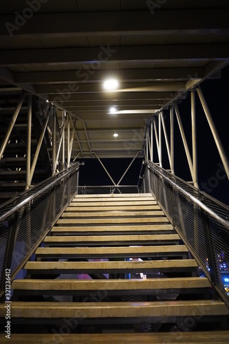 Fototapeta Naklejka Na Ścianę i Meble -  look at the stairs from the bottom corner up at night