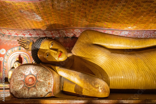 Buddha laying statue in Buddhist Dambulla cave temple (Golden Temple of Dambulla), Sri Lanka photo