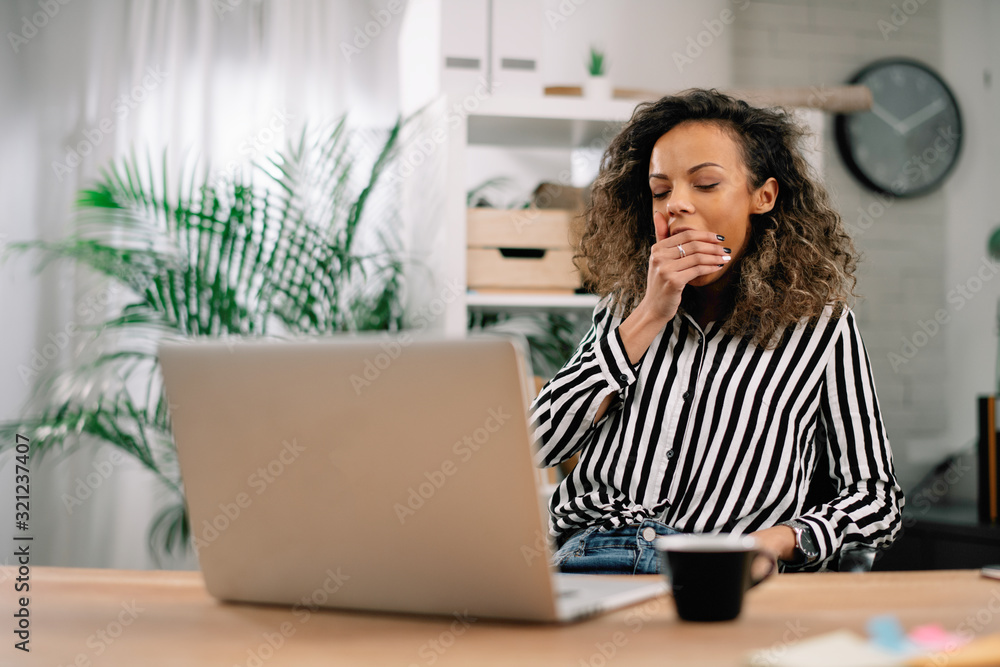 Sleepy businesswoman in office. African woman overworked. Sleepy businesswoman in office. African woman overworked.
